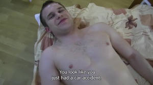 A young Czech boy dances in nature's garb in public park